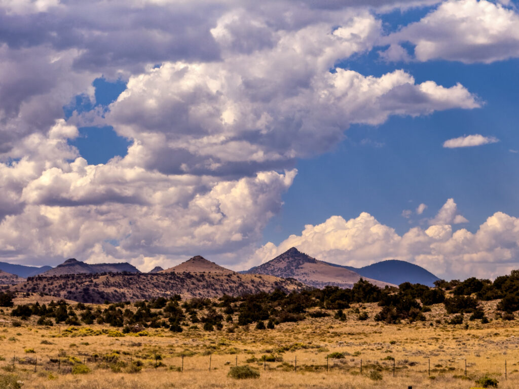 High Plains Volcanic Ridges & Cumulus Sky — Del Norte, Colorado (2026)