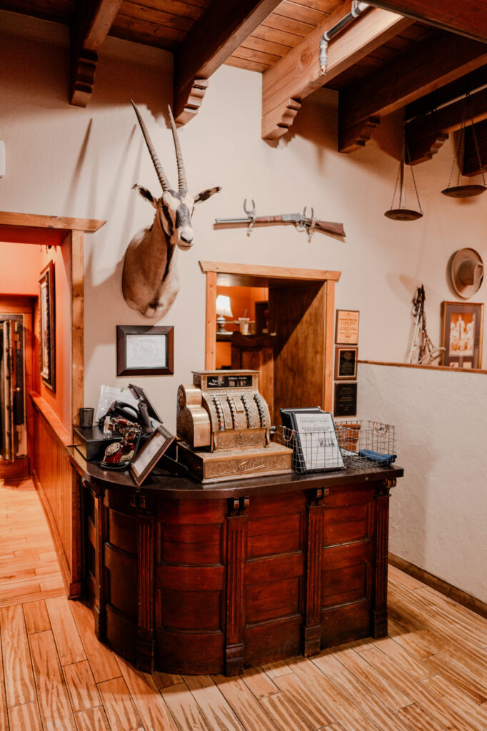 Antique Cash Register & Oryx Mount at Reception — Cimarron, New Mexico (2026)
