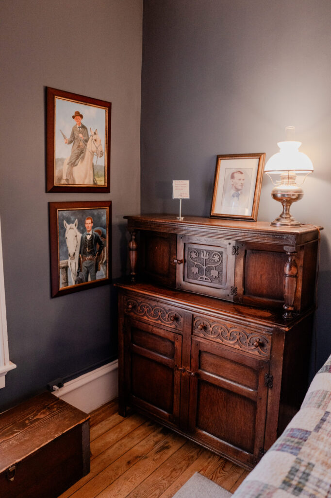 Antique Sideboard & Jesse James Artwork in Room #5 — Cimarron, New Mexico (2026)