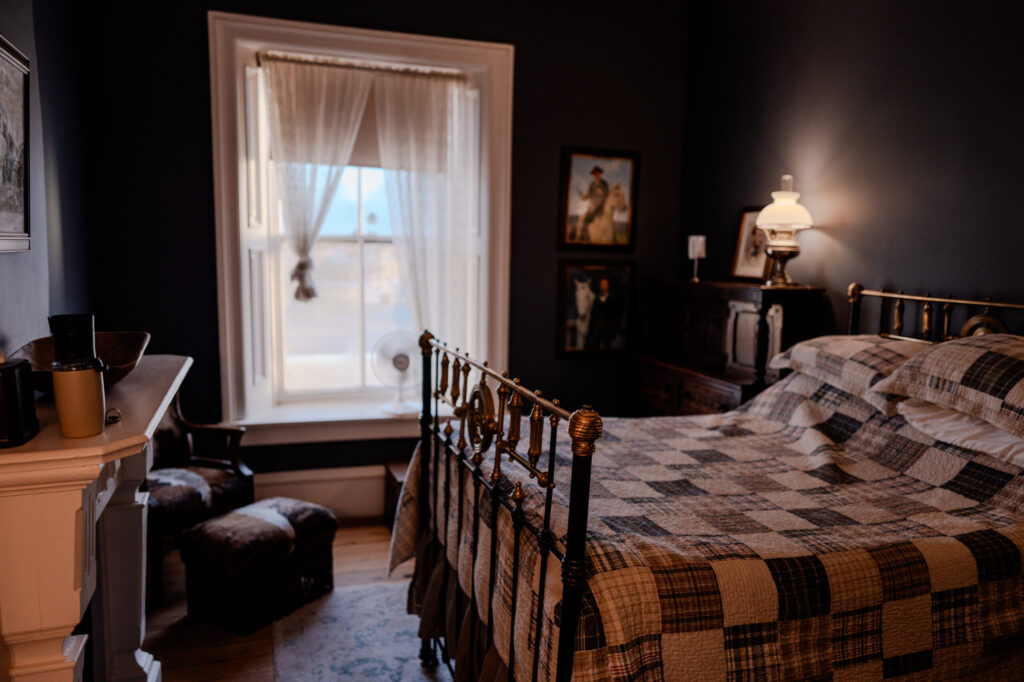 Jesse James Suite (Room #5) Bed & Fireplace — Cimarron, New Mexico (2026)