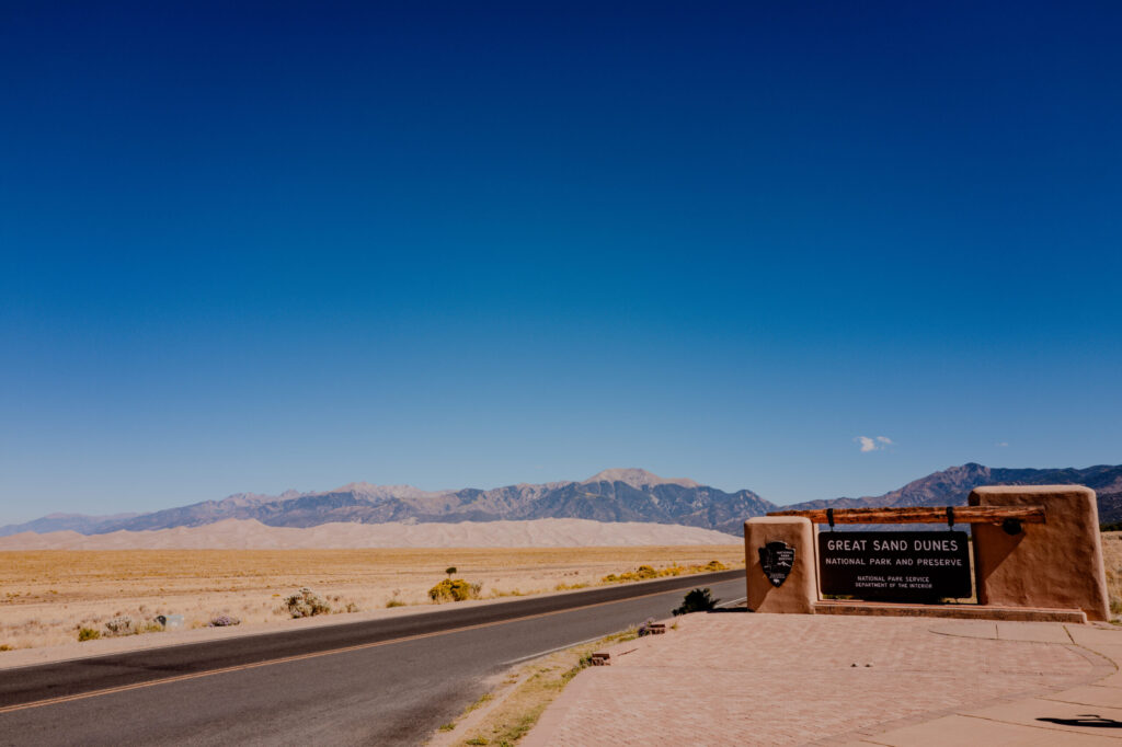 Great Sand Dunes Entrance Sign & Highway Approach — Great Sand Dunes National Park, Colorado (2026)